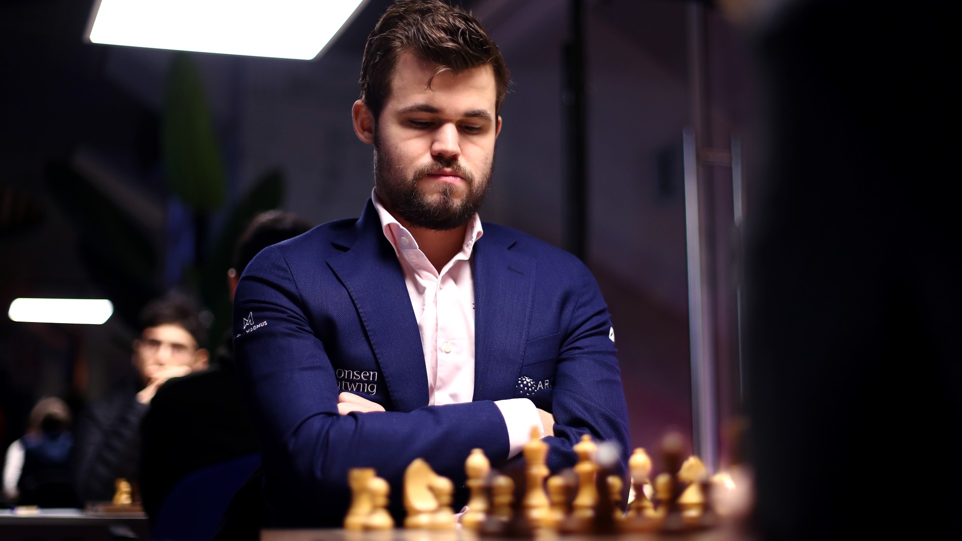 Who is Magnus Carlsen? How many Blitz, Rapid and World Chess Championships  has he won? How old is he? When did he start playing chess?