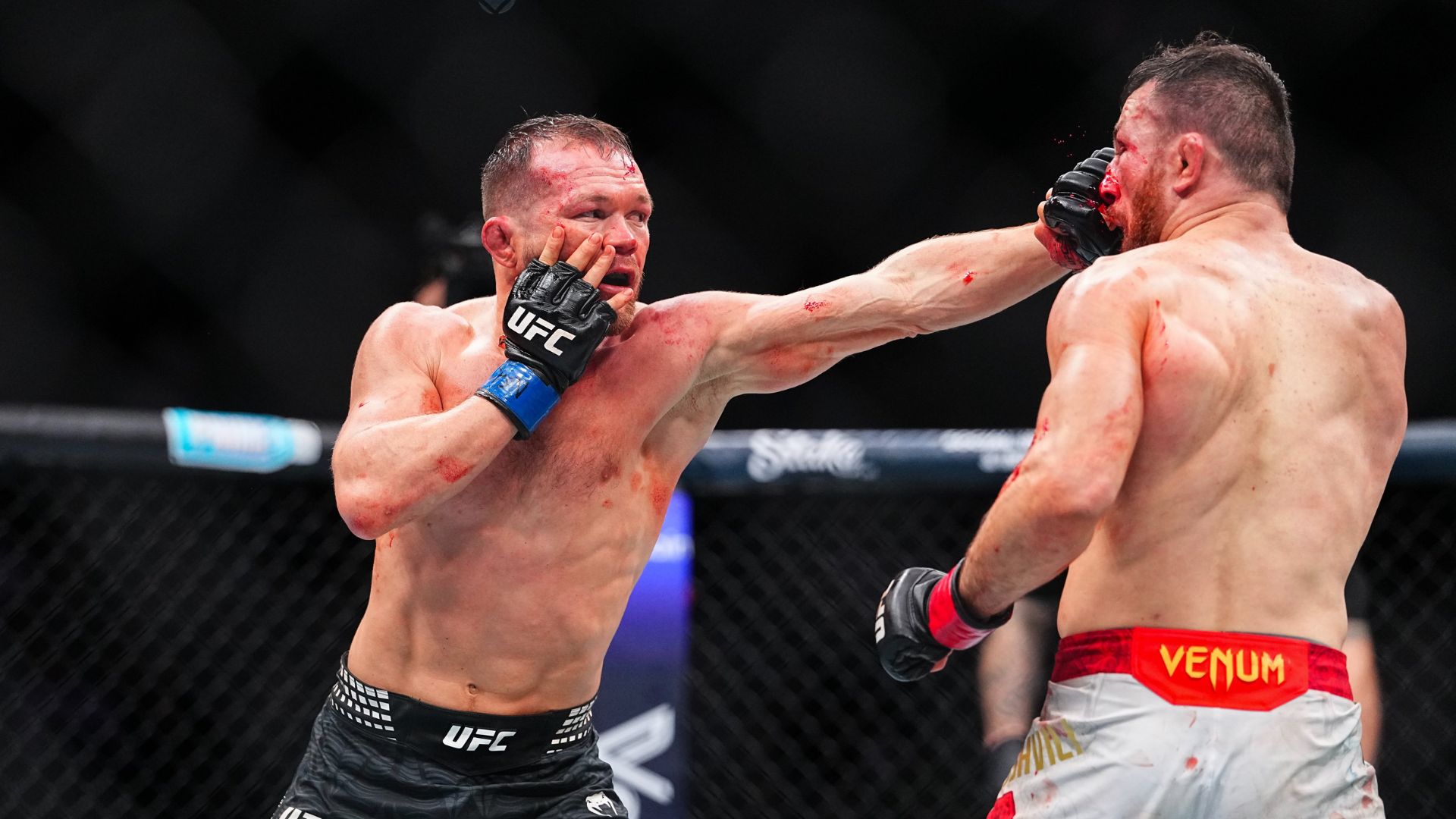 Petr Yan and Merab Dvalishvili exchanging in their title fight