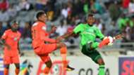 Justin Shonga of Orlando Pirates challenged by Sammy Seabi of Polokwane City
