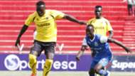 Tusker midfielder Collins Shivachi outpace Godfrey Walusimbi.
