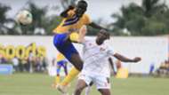 Gift Ali of KCCA FC shields the ball from Kyetume’s Baker Buyala.