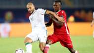 Adlane Guedioura of Algeria challenged by Francis Kahata of Kenya.