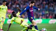Djene Dakonam of Getafe, and Barcelona's Lionel Messi