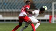 Kenya's Philemon Otieno (L) and Ghana's Christian Atsu (R).
