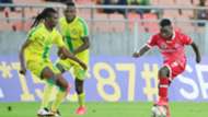 Simba SC midfielder Luis Miquissone and Papy Tshishimbi of Yanga SC.