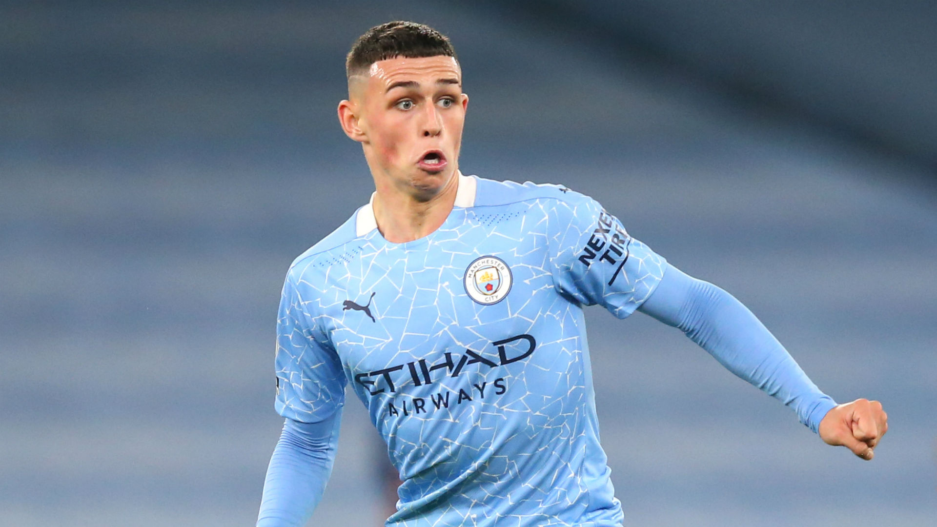  Phil Foden, a young English midfielder, playing for Manchester City.