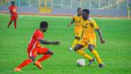Kotoko defender Augustine Sefa and Ashgold players