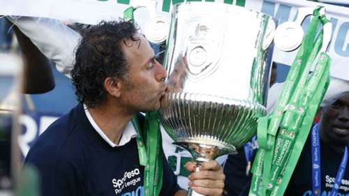 Gor Mahia coach Hassan Oktay with the KPL trophy.