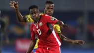 Eric Ouma of Kenya challenged by Thomas Ulimwengu of Tanzania.
