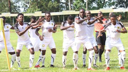 Eugine Asike and Henry Mejja of Tusker celebrate.