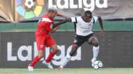 Vincent Oburu ® tackled by Bilal Boutobba of Sevilla