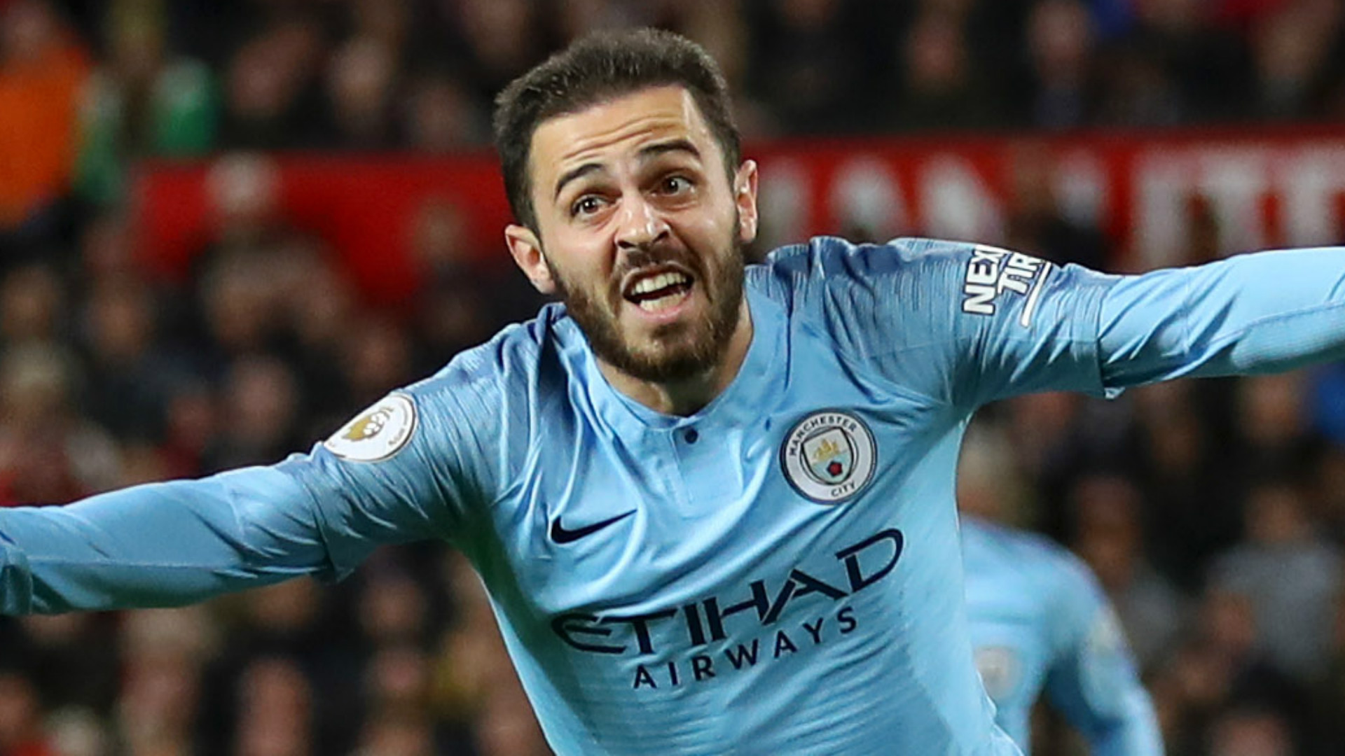  Bernardo Silva, a Portuguese midfielder, playing soccer for Manchester City, a premier league club, in a sky blue jersey with white shorts.