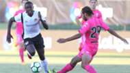 Vincent Oburu challenges for the ball with Javi Soler