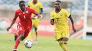 Eric Ouma of Kenya and Harambee Stars vs a Mozambique striker