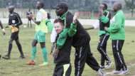 Gor Mahia coach Dylan Kerr and Zedekiah Otieno