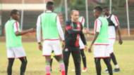 Aboud Omar and Harambee Stars coach Sebastien Migne.