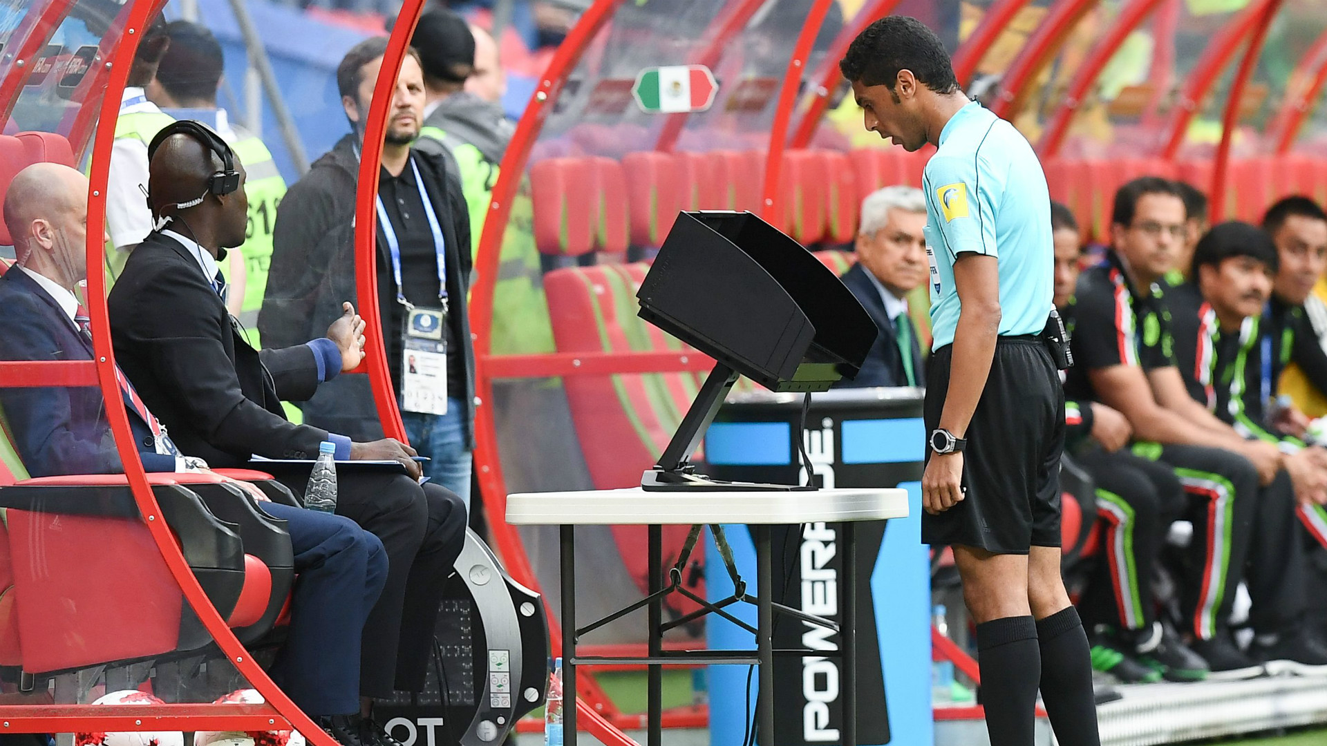 Referee checking the VAR for checking of a bad play