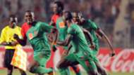 Malian Djoliba A C striker Alou Bagayoko (L) celebrates with teammates