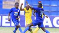Wyvonne Isuza of Wazito FC tackled by Posta Rangers players.