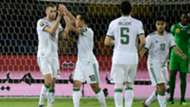 Islam Slimani celebrates with Algeria teammates