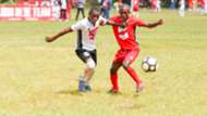 Makaole Swere (left) from Kinondo School shoves Salim Badi from St
