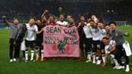 Liverpool fans hold a banner in tribute to injured fan Sean Cox
