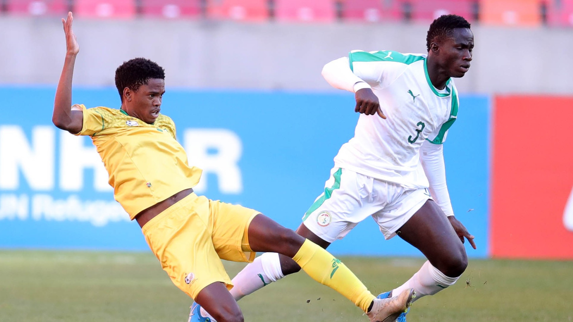 Woula Macire Sane of Senegal challenged by Sifiso Stanley Ngobeni of Bafana Bafana, July 2021