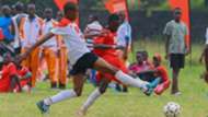 Allan Lukonzo of Goseta boys (L) fights for the ball with Serani’s Sufii Mohammed in the the COPA Coca-Cola U-16