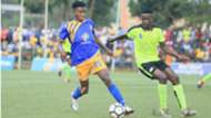 KCCA FC striker Allan Okello shields the ball from his Proline FC’s Arnold Sserunjogi.