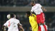 Joash Onyango of Kenya and Harambee Stars vs defends against Peniel Kokou of Togo.