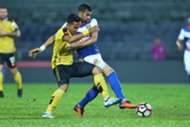 Perak's Shahrom Kalam (Perak) vies for the ball with Kelantan's Mohammed Ghaddar 1/3/2017