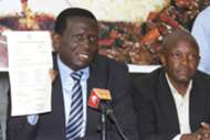 Mathews Opwora with registration certificate from government