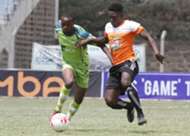 Athman Buki (l) of KCB tackles Eric Omonge of Nakuru All Stars
