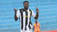 Kenyan striker Allan Wanga wheels away in delight aftrer scoring for Tusker in the final