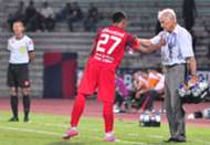 Perak head coach Karl Heinz Weigang handing out water to a PDRM player 3/8/2016