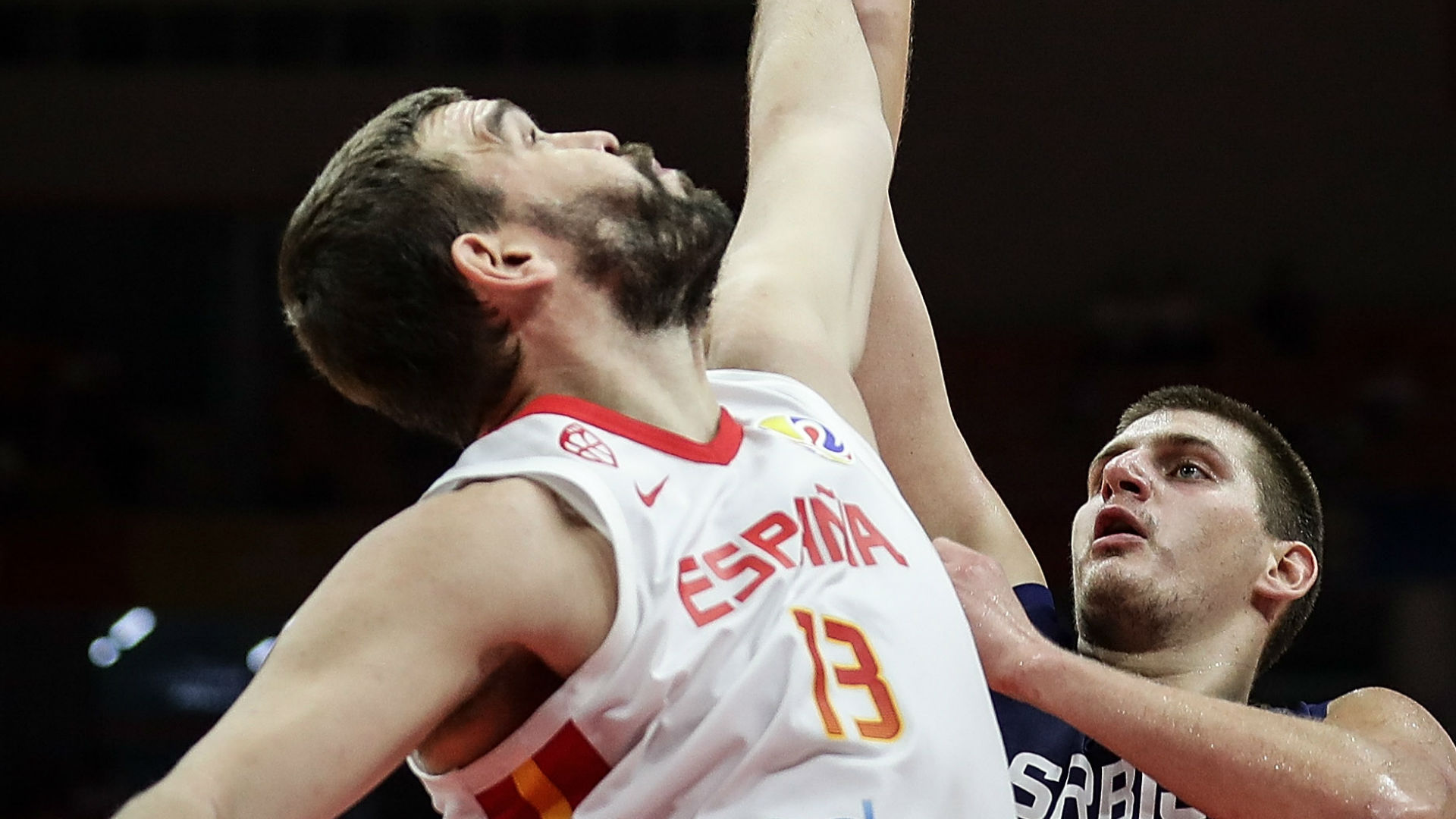 Marc Gasol challenges a shot by Nikola Jokic during Spain's win over Serbia.
