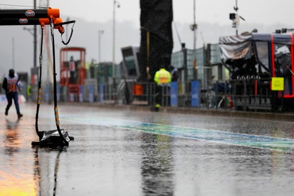 images-amp-2jXdwe96-s2-rain-soaks-the-pit-lane