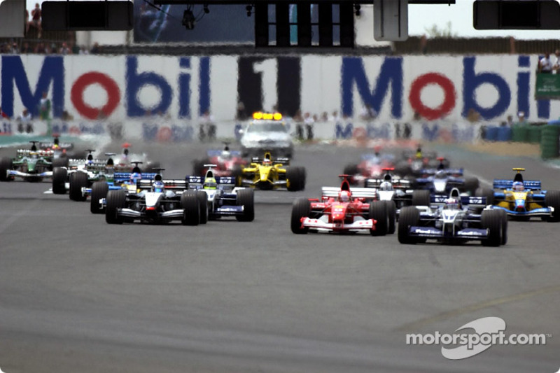 static-img-mgl-0-40000-43000-43100-43180-s8-f1-french-gp-2002-the-start-juan-pablo-montoya-leading-michael-schumacher