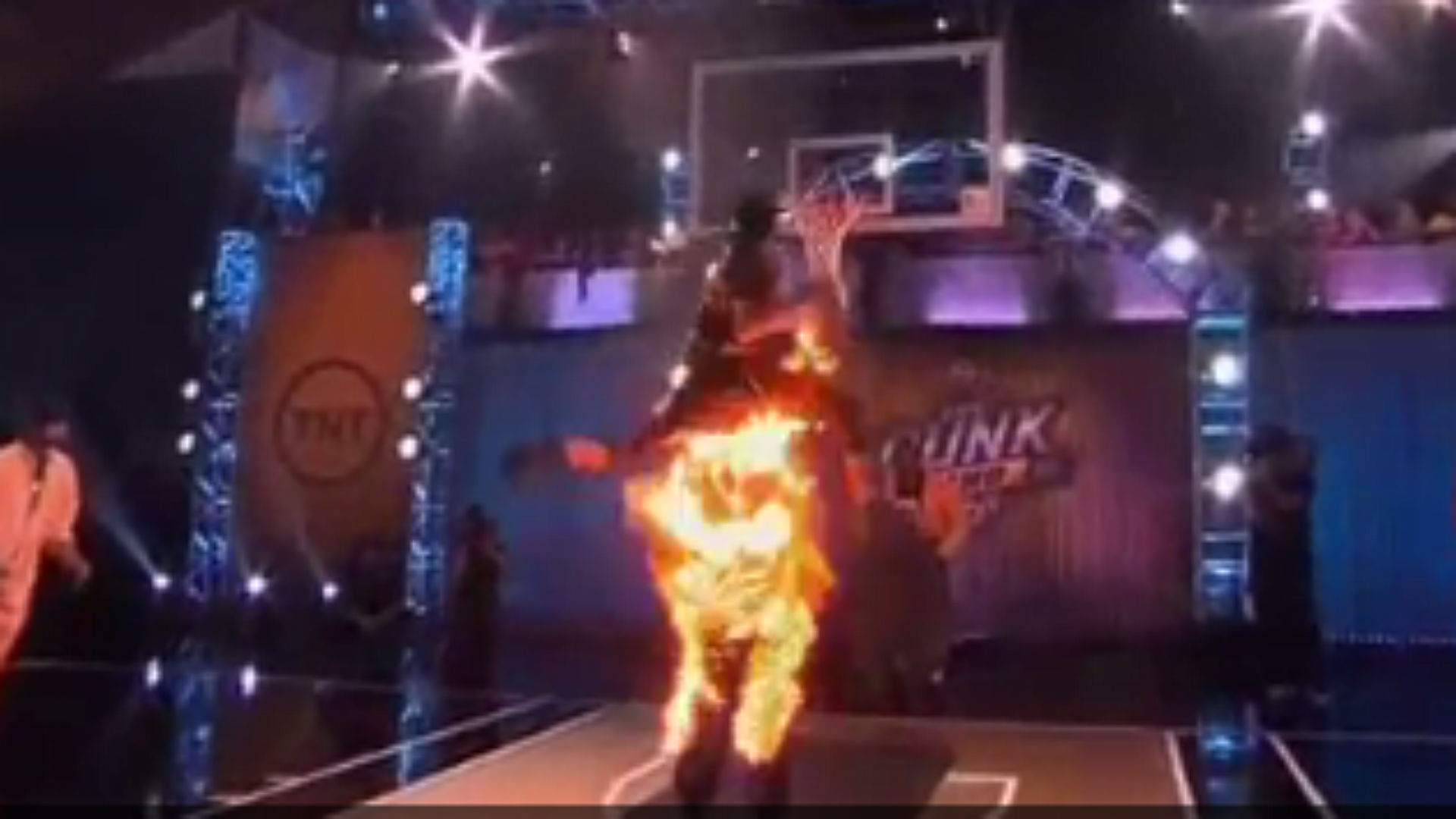Guy dunks over other guy, who is on fire, during TNT's 'The Dunk King